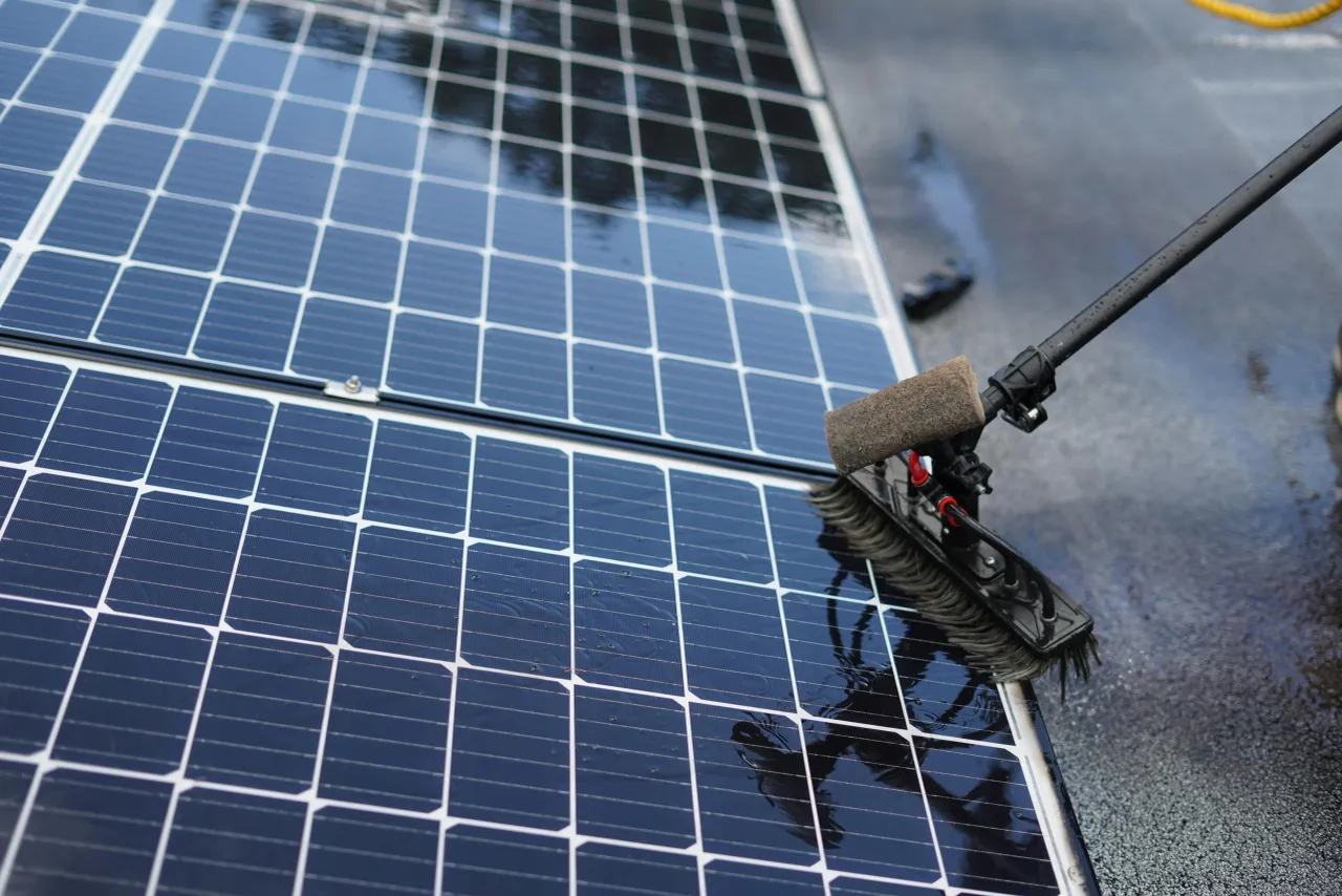 Solar panel surface being cleaned