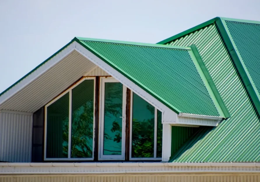 Green metal roof with dormer windows